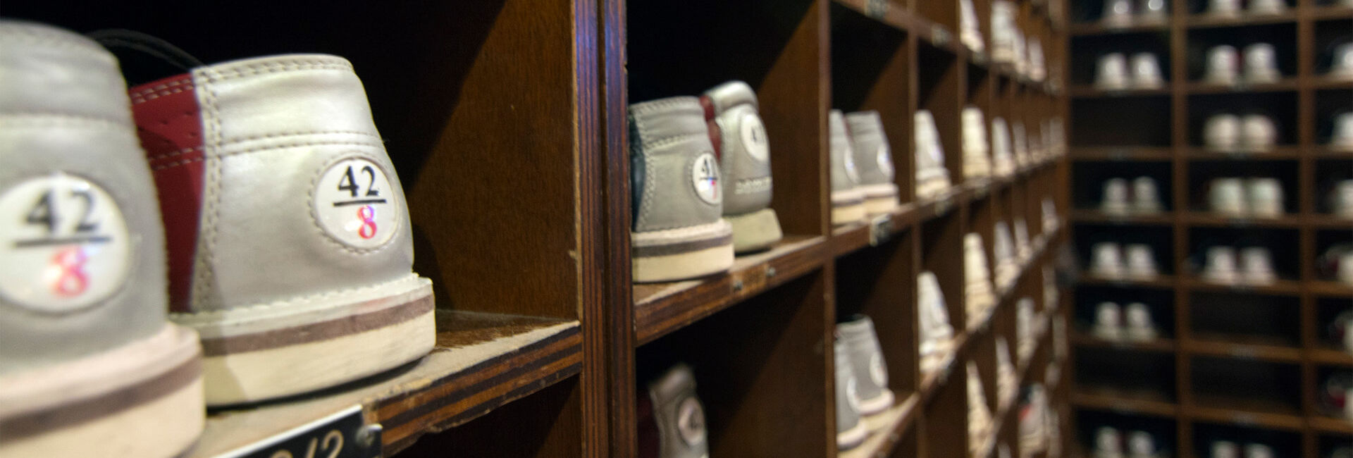 Shelves with bowling shoes in various sizes