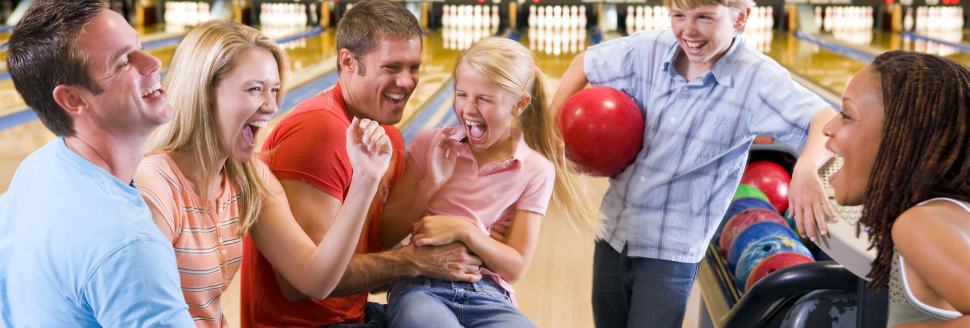 Family having fun bowling