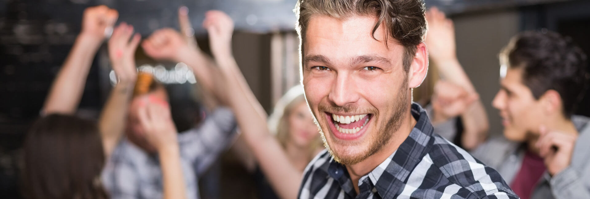 Man is happy while friends are cheering - Gasterij 't Karrewiel