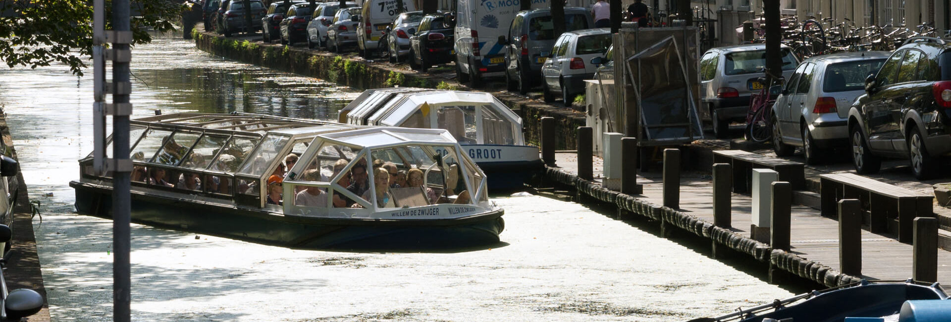 Canal boats in one of the Delft canals  - Explore Delft - Gasterij 't Karrewiel